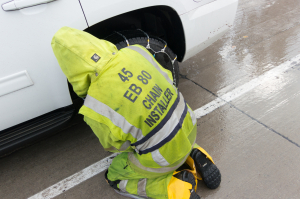 Nice photo of Chain Installer on interstate 80