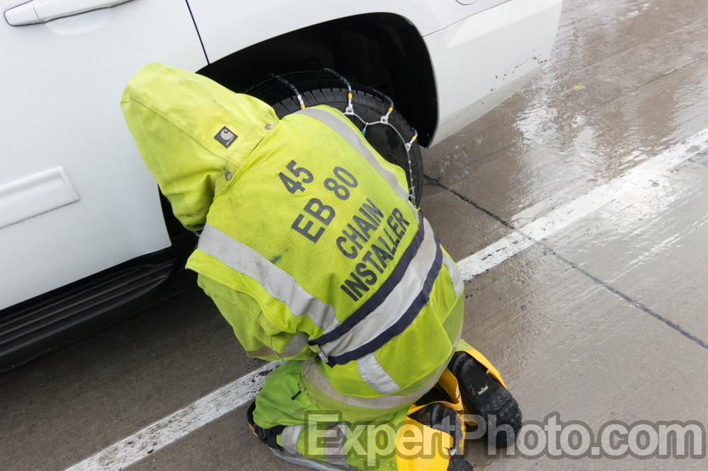 Nice photo of Chain Installer on interstate 80