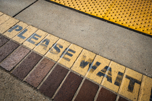 Nice photo of Please wait Sign